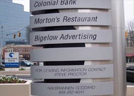White Sign with Black Lettering
